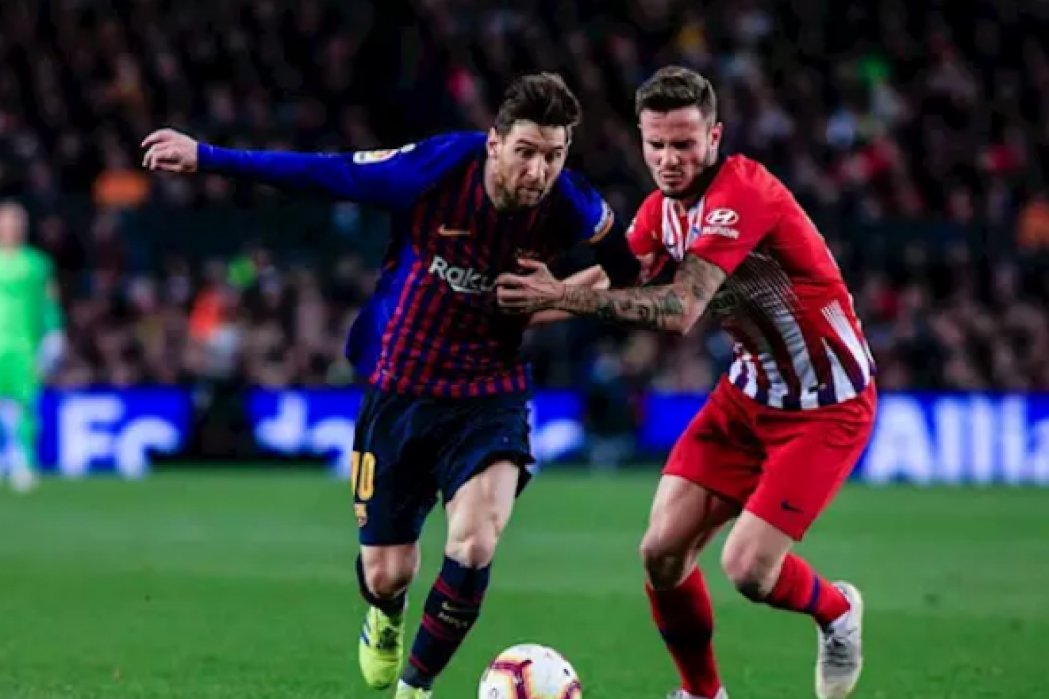 Messi y Saúl.