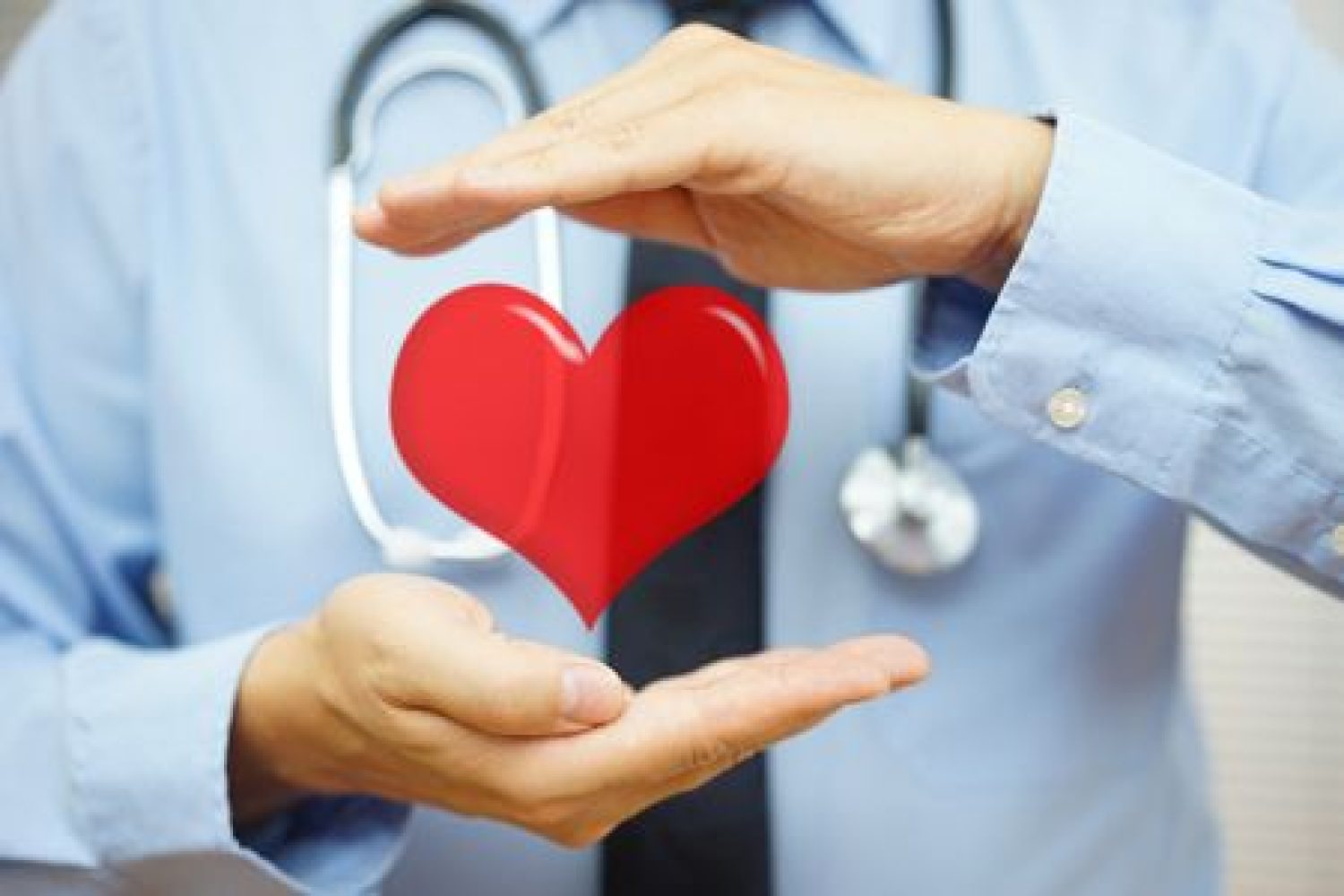 doctor is protecting heart  with hands. Health care and  Cardiovascular diseases  concept